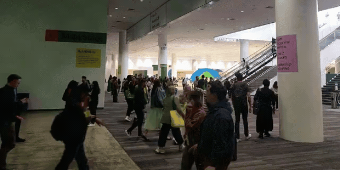 A diverse group of people gathered on the lower level during Config 2024 at Moscone Center South in San Francisco, CA
