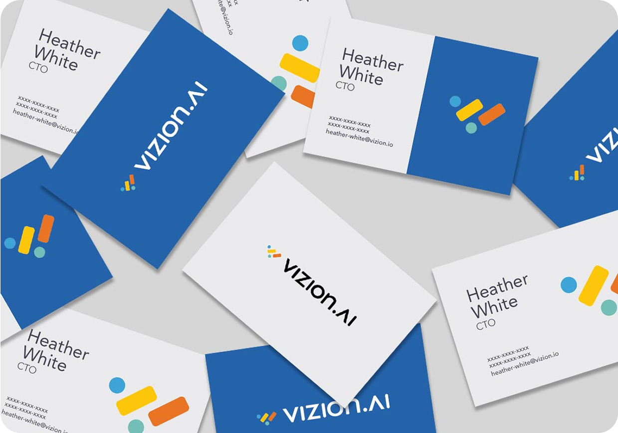 Business Card designs containing SeaLab's custom Vizion logo on blue and white